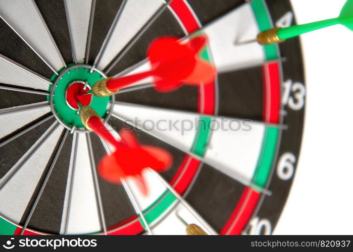 Close-up dart board with a red arrows that hit the center of the target. Darts Board Game