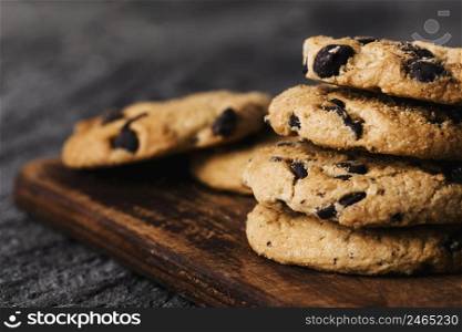 close up delicious cookies wooden board