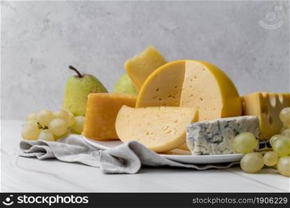 close up delicious variety cheese with grapes. High resolution photo. close up delicious variety cheese with grapes. High quality photo