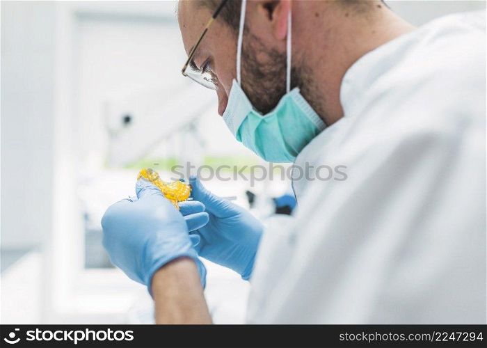close up dentist looking dental impression clinic