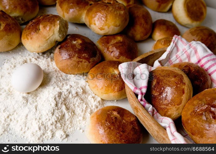 Close up detail of freshly baked hot cross buns in romantic renaissance lighting.