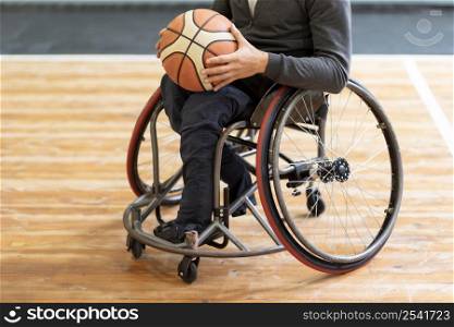 close up disabled man holding basketball