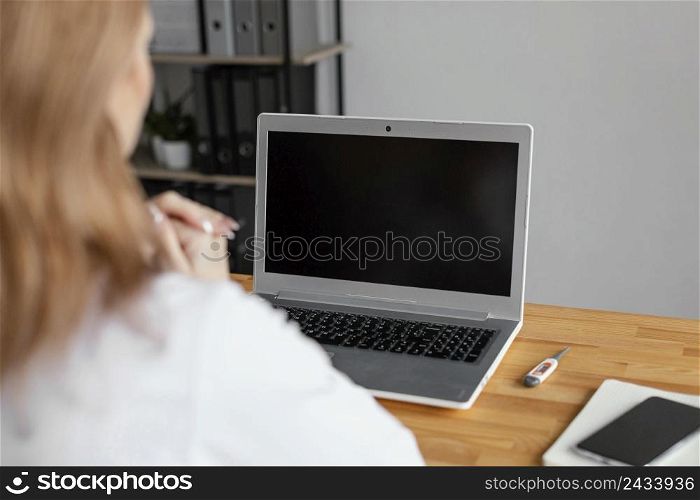 close up doctor checking patient with laptop