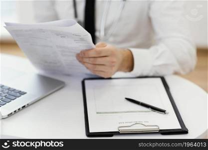 close up doctor holding medical records. High resolution photo. close up doctor holding medical records. High quality photo