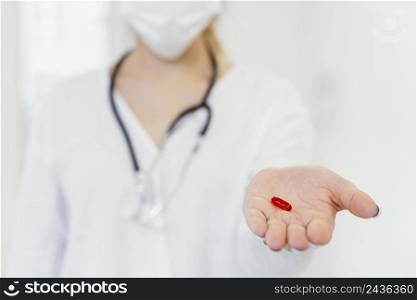 close up doctor holding pill 2