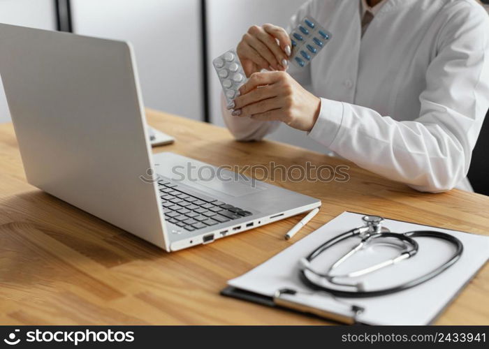 close up doctor holding pills