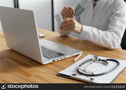 close up doctor holding pills