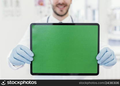 close up doctor holding tablet