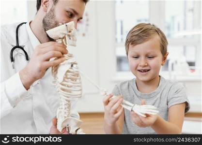 close up doctor kid with skeleton