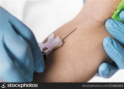 close up doctor taking blood sample from sick person