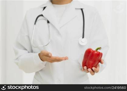 close up doctor with stethoscope bell pepper