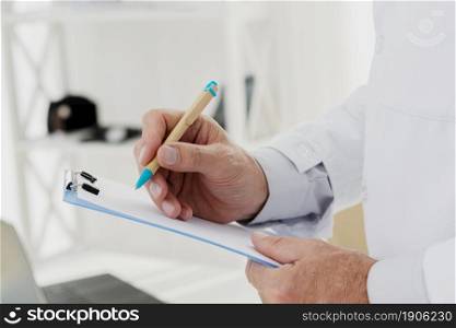 close up doctor writing clipboard. High resolution photo. close up doctor writing clipboard. High quality photo