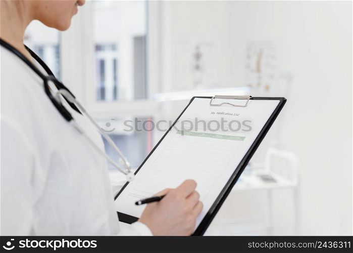 close up doctor writing information