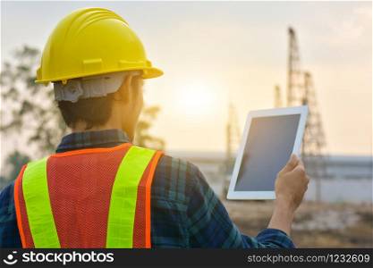 Close up Engineer Construction holding tablet checking work estate technology
