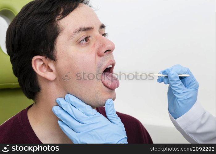 close up examination with tongue depressor