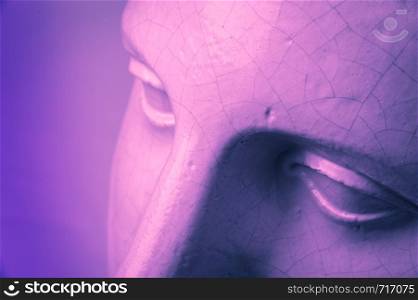Close up face gypsum copy antique sculpture with craquelure. Pink purple duotone lighting effect. Eyes.. Closeup face gypsum copy antique sculpture with craquelure. Pink purple vintage filter effect. Eyes.
