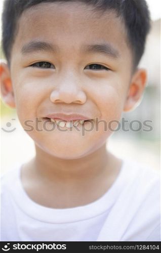 close up face of asian children tooth smiling face