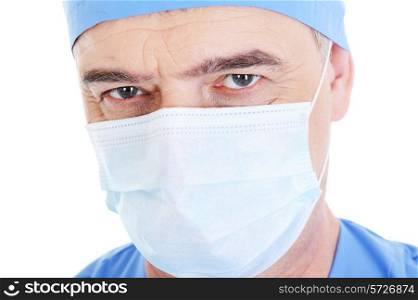close-up face of looking mature male surgeon in medical mask