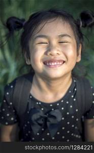 close up face of lovely asian children funny emotion