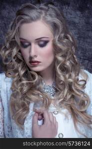 close-up fashion portrait of sensual blonde woman with long curly hair, stylish make-up and vintage aristocratic style.