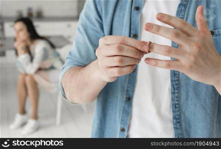 close up father taking wedding ring off. Beautiful photo. close up father taking wedding ring off