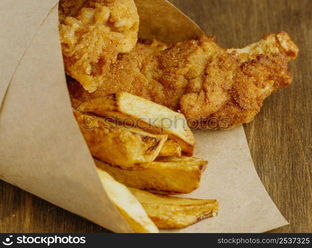 close up fish chips paper wrap