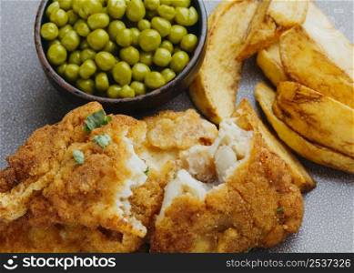 close up fish chips with peas