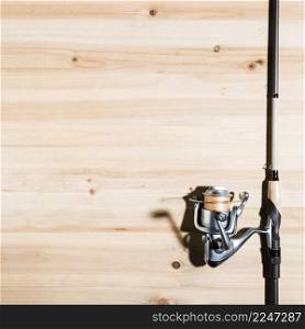 close up fishing rod wooden desk