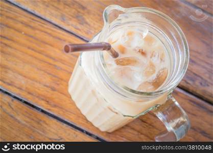Close up fresh iced coffee latte in glass pitcher, stock photo