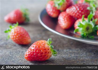close up fresh red strawberries over wooden background. close up strawberry