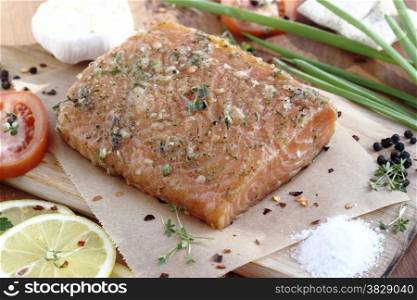 Close up fresh salted salmon fillet with spices