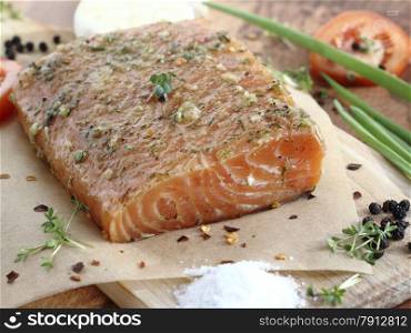 Close up fresh salted salmon fillet with spices