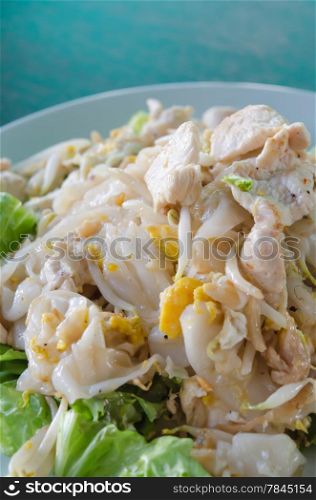 close up Fried Noodles with Chicken and vegetable on dish