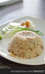 close up fried rice with pork served with fresh vegetable