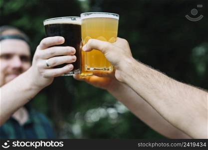 close up friend s hand cheering glass alcoholic drinks