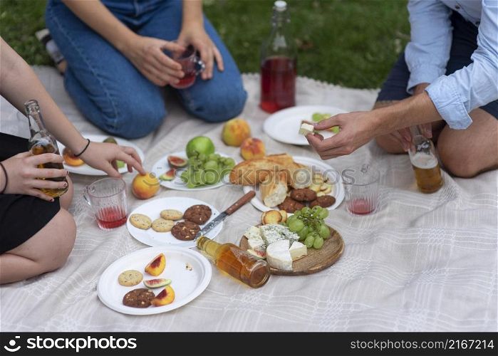 close up friends eating picnic