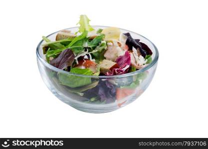 Close up front view of a fresh salad in glass bowl isolated on white.