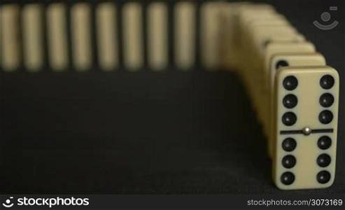 Close up frontal view of the domino effect in slow motion 96fps