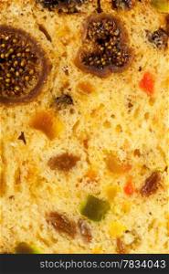 Close up fruit cake panettone stollen as food background