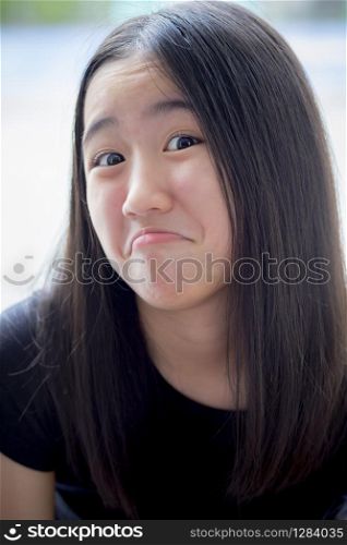close up funny kidding face of asian teenager