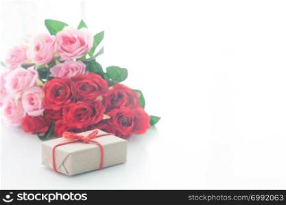 Close up gift box with rose on white background