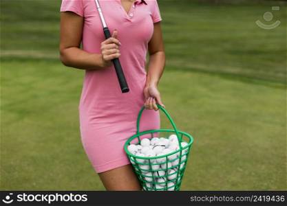 close up girl holding golf basket
