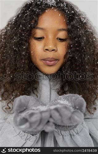 close up girl posing with snow