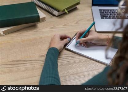 close up girl writing notebook
