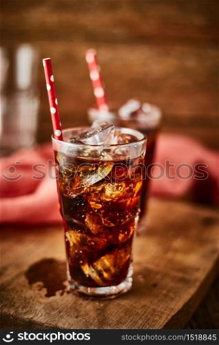 Close up glass of refreshing cola with ice on table.. Close up glass of refreshing cola.