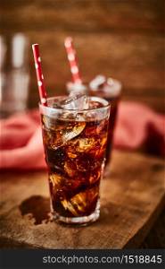 Close up glass of refreshing cola with ice on table.. Close up glass of refreshing cola.