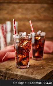 Close up glass of refreshing cola with ice on table. . Close up glass of refreshing cola. 