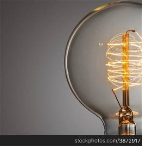 Close up glowing vintage light bulb