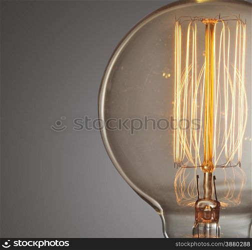 Close up glowing vintage light bulb