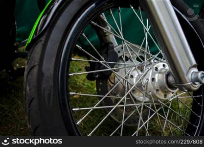 close up green motorcycle tire